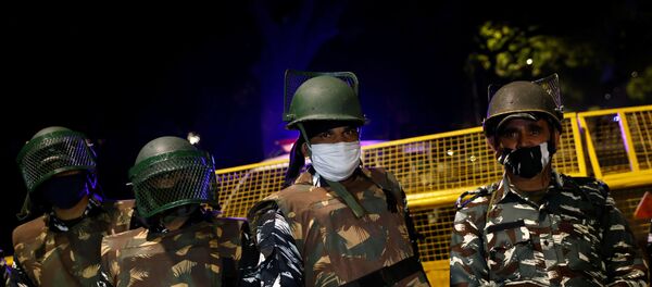 Paramilitary troops stand guard after an explosion near the Israeli embassy in New Delhi, India, January 29, 2021. - Sputnik International