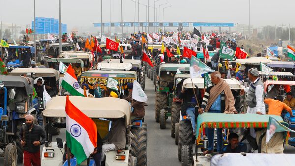 FILE PHOTO: Farmers participate in a tractor rally to protest against the newly passed farm bills, on a highway on the outskirts of New Delhi, India, January 7, 2021.  - Sputnik International