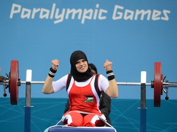 Jordanian athlete Fatama Ahmed during powerlifting competitions among women in the 52 kg category at the XIV Paralympic Games in London - Sputnik International