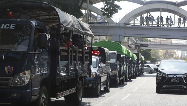 Policemen sit inside trucks parked on a road in the downtown area of Yangon, Myanmar - Sputnik International
