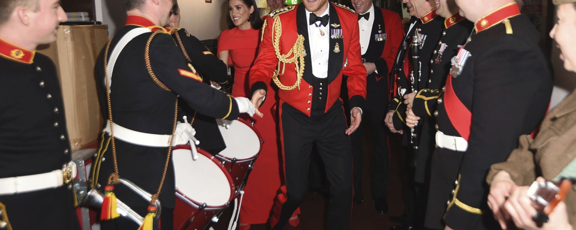 Britain's Prince Harry and Meghan, Duchess of Sussex, meet the Massed Bands of Her Majesty's Royal Marines at the Mountbatten Festival of Music at the Royal Albert Hall in London, Saturday, March 7, 2020 - Sputnik International, 1920, 18.06.2021