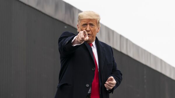 President Donald Trump points to a member of the audience after speaking near a section of the U.S.-Mexico border wall, Tuesday, Jan. 12, 2021, in Alamo, Texas - Sputnik International