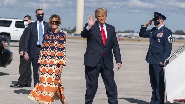 Former President Donald Trump and Melania Trump waves upon arrival at Palm Beach International Airport in West Palm Beach, Florida., Wednesday, 20 January 2021 - Sputnik International