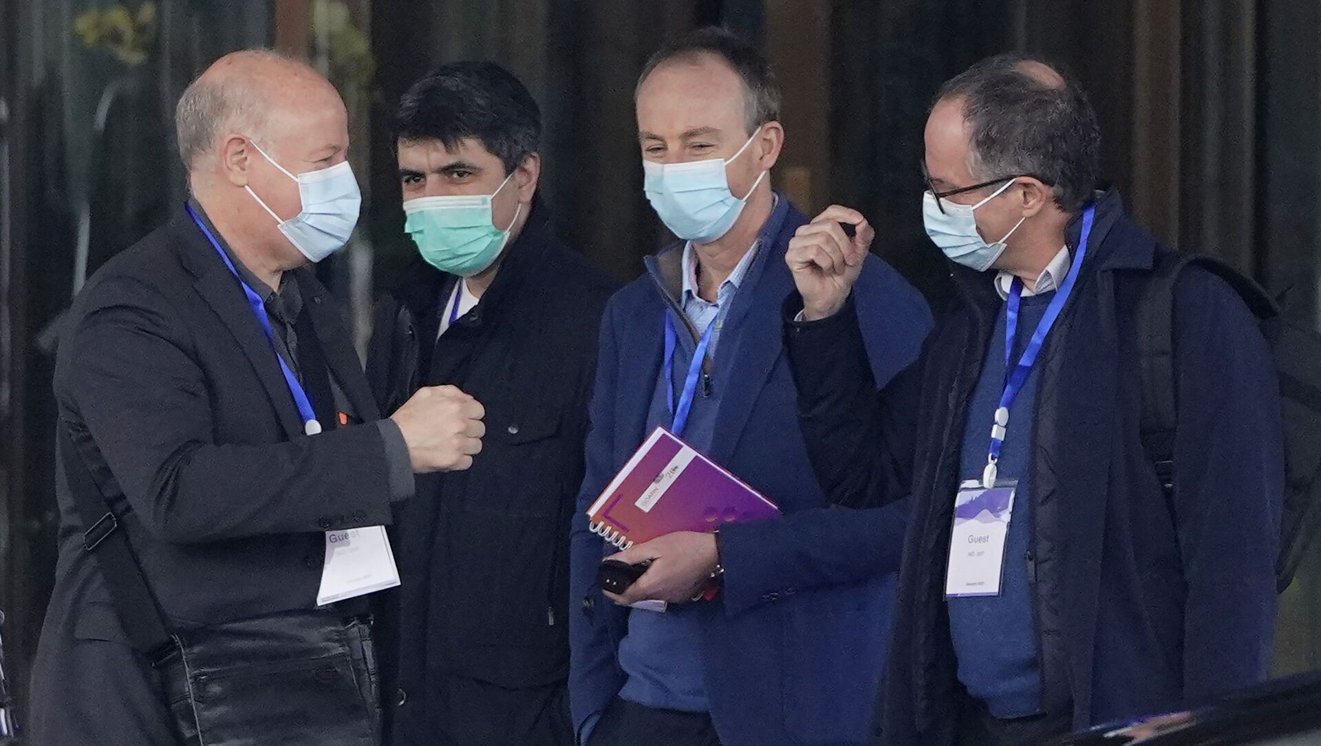 Peter Ben Embarek, right, gestures as Peter Daszak, left, approaches to bump fists with him before they leave the hotel with other members of a World Health Organization team for another day of field visit in Wuhan in central China's Hubei province Tuesday, Feb. 2, 2021 - Sputnik International, 1920, 26.02.2021