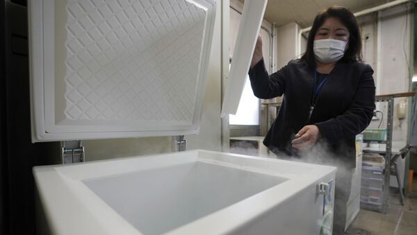 A local health staff shows a special freezer for COVID-19 vaccinations at Tokyo's Sumida ward office Friday, Jan. 22, 2021. Japan is accelerating preparations for COVID-19 vaccinations in hopes of starting them in late February, but uncertainty is growing as the country faces vaccine-shy public, slow approval process and bureaucratic roadblocks, casting a doubt if Tokyo Olympic this summer is possible. - Sputnik International
