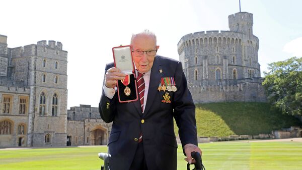 Captain Tom Moore poses after being awarded with the insignia of Knight Bachelor by Britain's Queen Elizabeth at Windsor Castle, in Windsor, Britain July 17, 2020. - Sputnik International