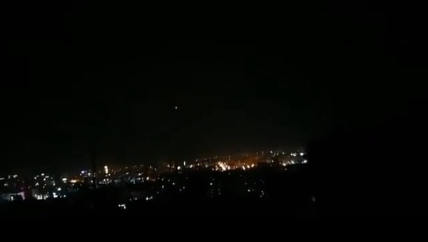 A screenshot from the video of the alleged anti-air missile exploding in the night sky in Syria - Sputnik International