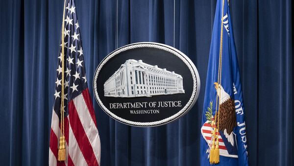 A sign for the Department of Justice is seen ahead of a news conference with Michael Sherwin, acting US attorney for the District of Columbia, and Steven D'Antuono, head of the Federal Bureau of Investigation (FBI) Washington field office, at the US Department of Justice in Washington, DC, on January 12, 2021. - Sputnik International