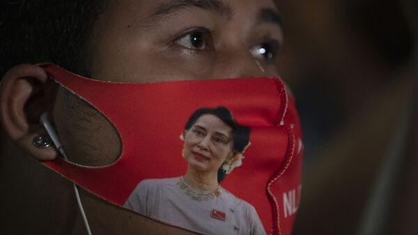 A Myanmar national living in Thailand wears a face mask with the image of Myanmar leader Aung San Suu Kyi during a protest in front of Myanmar Embassy in Bangkok, Thailand, Thursday, Feb. 4, 2021. The military announced Monday that it will take power for one year, accusing Suu Kyi's government of not investigating allegations of voter fraud in recent elections. Suu Kyi's party swept that vote and the military-backed party did poorly. The state Election Commission has refuted the allegations. - Sputnik International