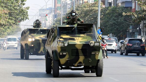 Myanmar Army armored vehicles drive in a street after the military seized power in a coup in Mandalay, Myanmar February 3, 2021. - Sputnik International