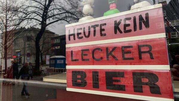 A sign which reads No tasty beer today is on display in the window of a closed bar in Berlin's Kreuzberg district on February 4, 2021 amid the ongoing coronavirus COVID-19 pandemic. - Sputnik International