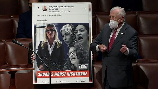 U.S. House Majority Leader Steny Hoyer (D-MD) mimics holding a gun next to an enlarged Tweet as he speaks during debate ahead of a House of Representatives vote on a Democratic-backed resolution that would punish Republican congresswoman Marjorie Taylor Greene, in this frame grab from video shot inside the House Chamber of the Capitol in Washington, U.S., February 4, 2021. - Sputnik International