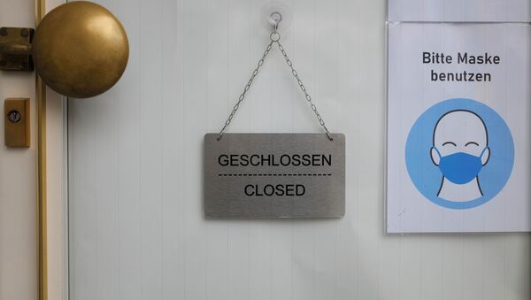 The door of a closed watch shop is seen as the spread of the coronavirus disease (COVID-19) continues during an extended lockdown in Frankfurt, Germany, 8 January 2021. - Sputnik International