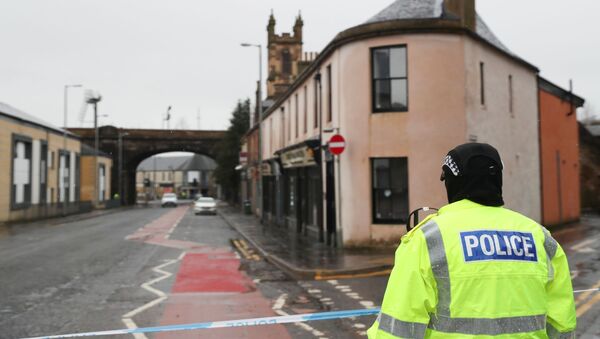 A police officer stands guard on Portland Street, following three major incidents reported in Kilmarnock, Scotland, Britain, February 5, 2021.  - Sputnik International