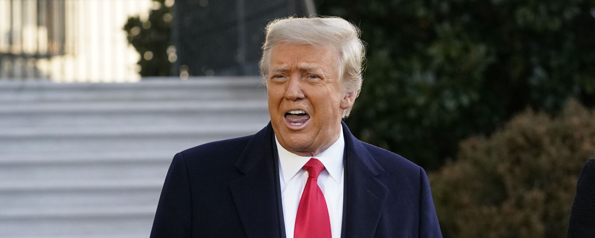 President Donald Trump speaks with reporters as he walks to board Marine One on the South Lawn of the White House, Wednesday, Jan. 20, 2021, in Washington. - Sputnik International, 1920, 29.04.2021