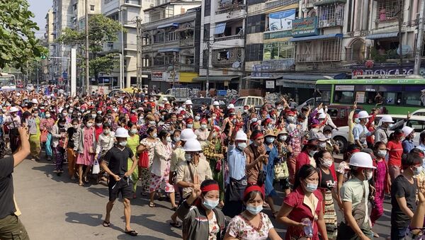 In this image from video, a crowd of protesters march in Yangon, Myanmar Saturday, Feb. 6, 2021 - Sputnik International