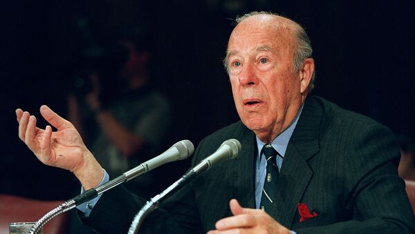 In this file photo former US Treasury Secretary and Secretary of State George Shultz testifies before the US Senate Foreign Relations Committee on February 29, 2000 on Capitol Hill in Washington, DC. - Sputnik International