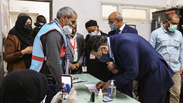 Fayez Sarraj, outgoing prime minister of the UN-recognised Libyan Government of National Accord (GNA), registers to vote during an election for the Tripoli Municipal Council, in Libya's capital on February 6, 2021. - Sputnik International