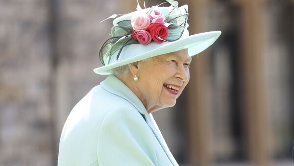 Britain's Queen Elizabeth smiles after awarding Captain Sir Thomas Moore his knighthood during a ceremony at Windsor Castle in Windsor, England, Friday, July 17, 2020. - Sputnik International