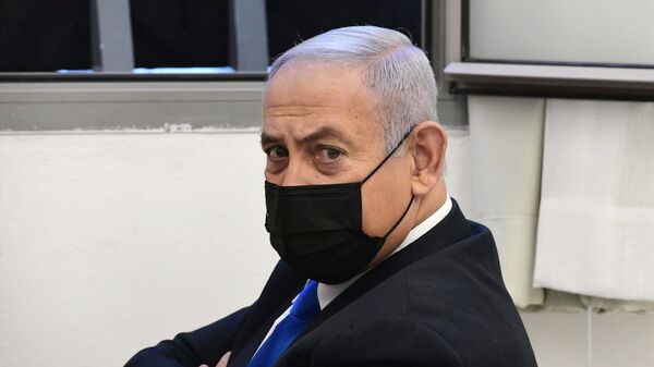 Israeli Prime Minister Benjamin Netanyahu looks on before the start of a hearing in his corruption trial at Jerusalem's District Court, 8 February 2021. - Sputnik International