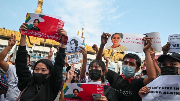 People hold placards depicting elected leader Aung San Suu Kyi during a rally to demand her release and protest against the military coup, in Yangon, Myanmar, February 8, 2021 - Sputnik International