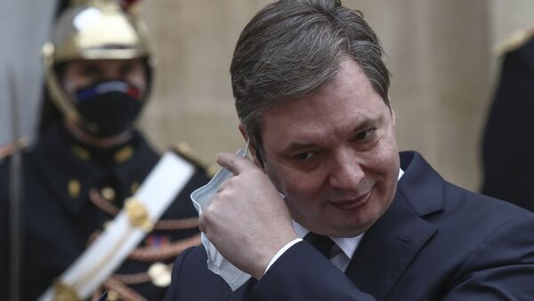 Serbian President Aleksandar Vucic takes off his face mask as he meets the media with French President Emmanuel Macron prior to a working lunch at the Elysee Palace in Paris, Monday, 1 Feb 2021.  - Sputnik International