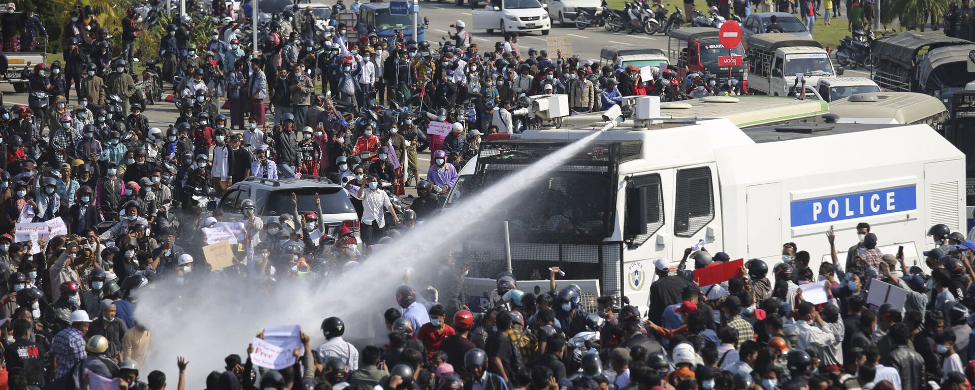 A police truck sprays water to a crowd of protesters in Naypyitaw, Myanmar on Monday, Feb. 8, 2021.  - Sputnik International, 1920, 22.02.2021