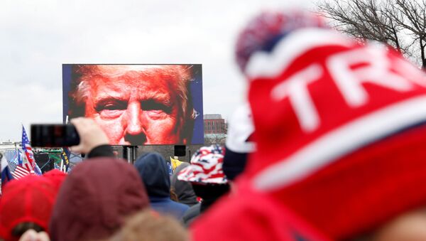 U.S. President Donald Trump is seen on a screen speaking to supporters during a rally to contest the certification of the 2020 U.S. presidential election results by the U.S. Congress, in Washington, U.S, January 6, 2021. Picture taken January 6, 2021 - Sputnik International