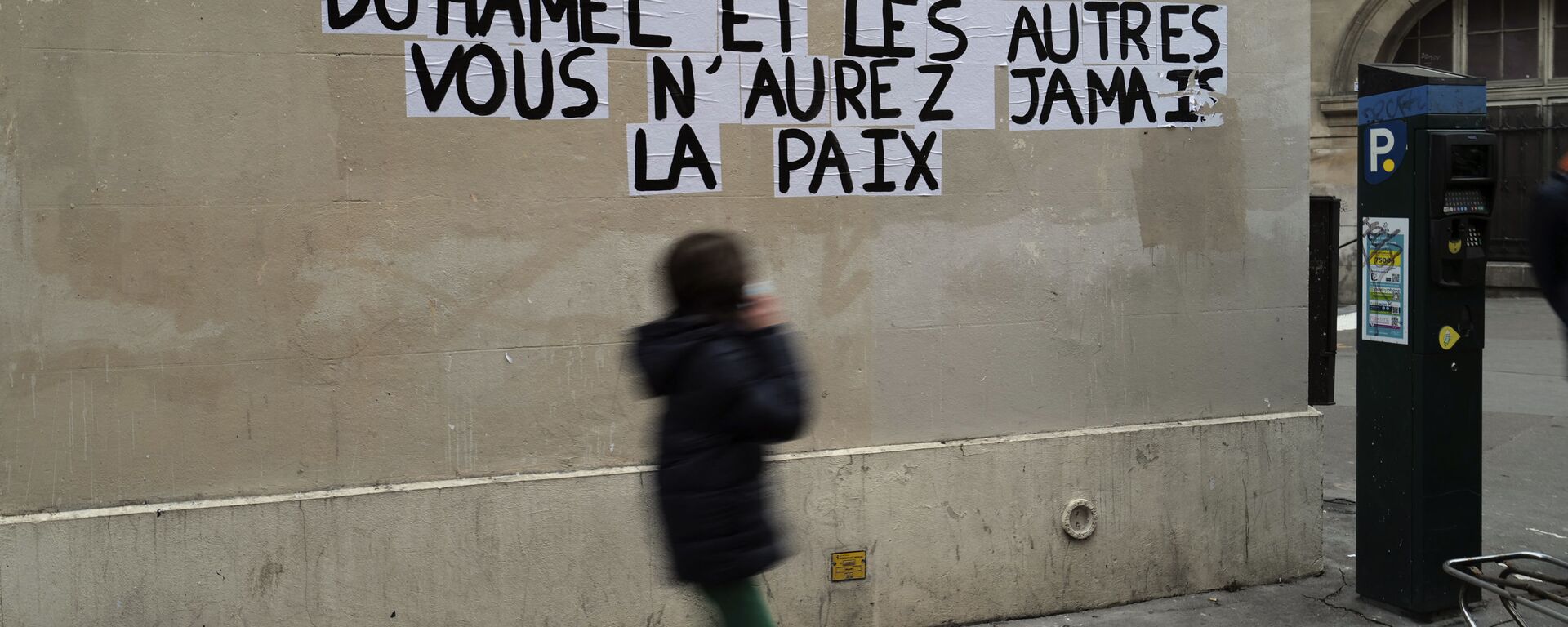 Signs on the wall reads Duhamel, and the others, you will never be in peace referring to prominent French political expert, Olivier Duhamel, in Paris, Tuesday, Jan. 19, 2021. The French government pledged on Thursday to toughen laws on the rape of children, as a massive online movement has seen hundreds of victims share accounts about sexual abuses within their families under the hashtag #MeTooInceste. - Sputnik International, 1920, 09.02.2021