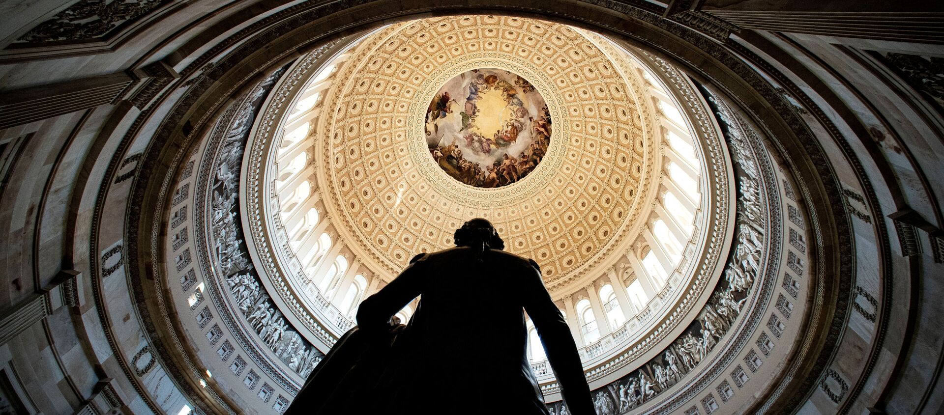 Rotunda of the U.S. Capitol is seen behind a statue of former President George Washington, before the second impeachment trial for former President Donald Trump, at the Capitol in Washington, U.S., February 9, 2021. - Sputnik International, 1920