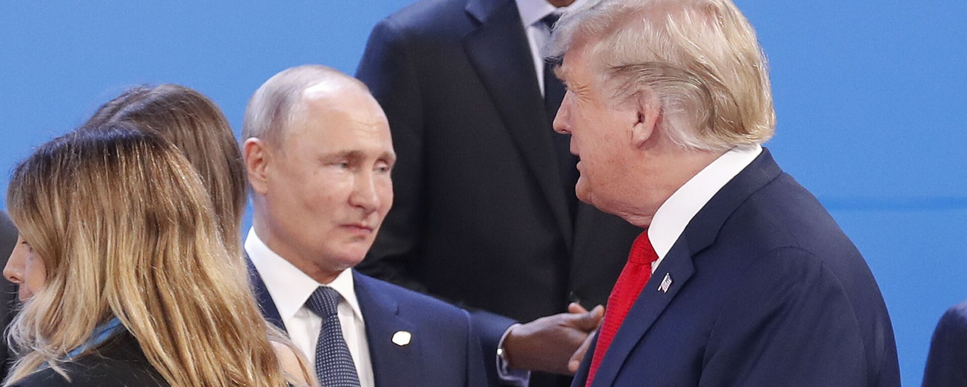 President Donald Trump, right, walk past Russia's President Vladimir Putin, left, as they gather for the group photo at the start of the G20 summit in Buenos Aires, Argentina, Friday, Nov. 30, 2018 - Sputnik International, 1920, 01.05.2025