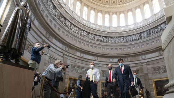 Rep. Jim Jordan, R-Ohio, left, and others walk through the Rotunda to the Senate for the second impeachment trial of former President Donald Trump, Tuesday, Feb. 9, 2021, in Washington. - Sputnik International