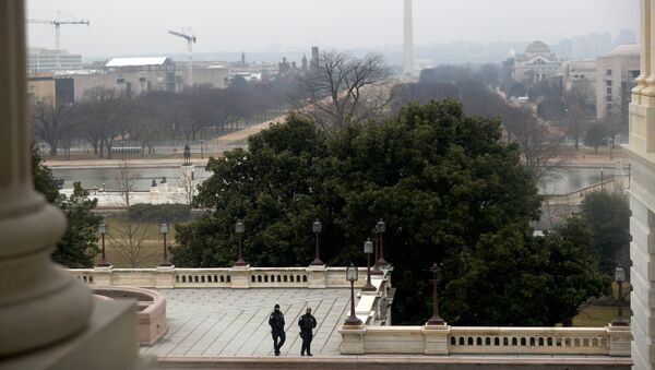 U.S. Capitol officers walk during the third day of senate impeachment hearings against former U.S. President Donald Trump, at the U.S. Capitol - Sputnik International