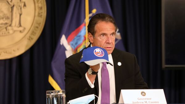 SEPTEMBER 08: New York state Gov. Andrew Cuomo holds an NHL New York Islanders hat at a news conference on September 08, 2020 in New York City. Cuomo, though easing restrictions on casinos and malls throughout the state, has declined to do so for indoor dining in restaurants in New York City despite pressure from business owners, citing struggles by the city to enforce the state's previous orders. - Sputnik International