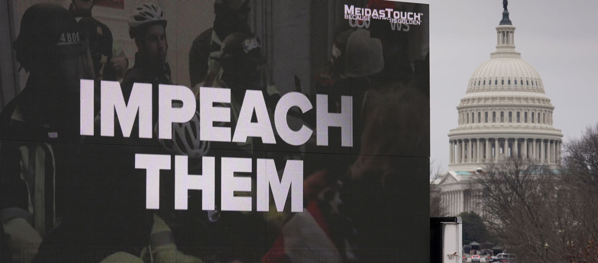 A video screen affixed to a truck flashes an anti-Trump message near the U.S. Capitol during former U.S President Donald Trump's second impeachment trial in Washington, U.S., February 12, 2021 - Sputnik International, 1920, 12.02.2021