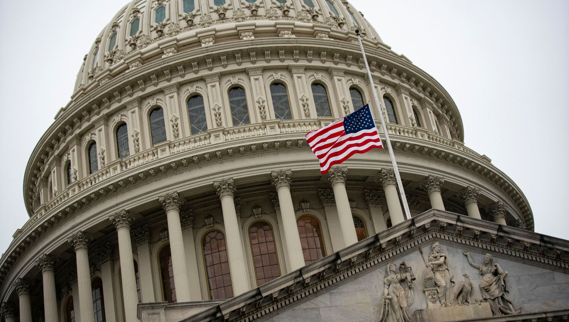 The American flag flies at half staff at the U.S. Capitol Building on the fifth day of the impeachment trial of former U.S. President Donald Trump, on charges of inciting the deadly attack on the U.S. Capitol, in Washington, U.S., February 13, 2021. - Sputnik International, 1920, 13.02.2021