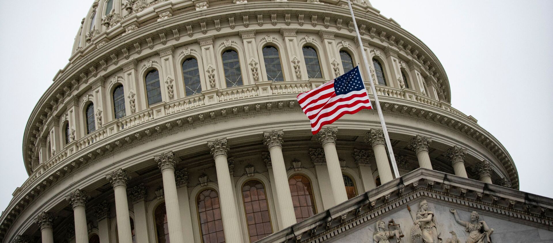 The American flag flies at half staff at the U.S. Capitol Building on the fifth day of the impeachment trial of former U.S. President Donald Trump, on charges of inciting the deadly attack on the U.S. Capitol, in Washington, U.S., February 13, 2021. - Sputnik International, 1920, 03.03.2021