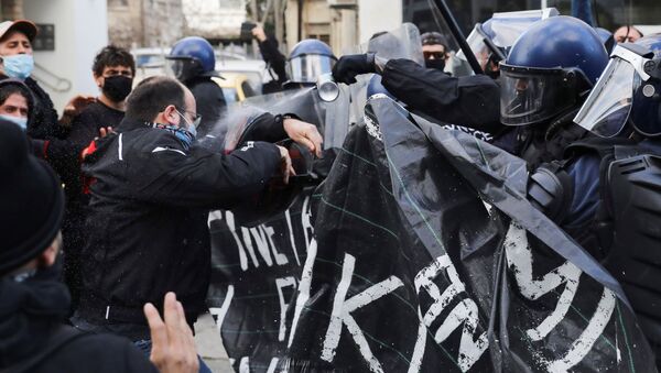 Protesters and activists clash with riot police during a rally against corruption and COVID-19 restriction measures, in Nicosia, Cyprus February 13, 2021 - Sputnik International