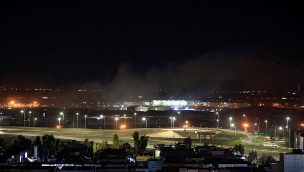Smoke rises over the Erbil, after reports of mortar shells landing near Erbil airport, Iraq February 15, 2021. - Sputnik International