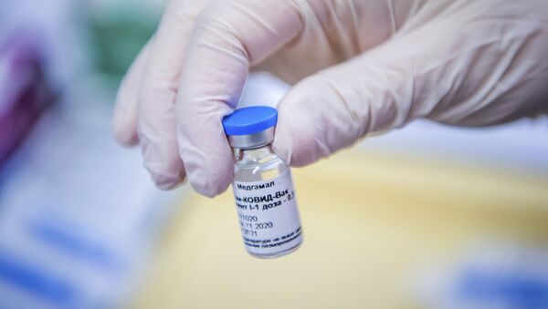 A vial containing Russian vaccine Sputnik V is shown by a nurse at the South Pest Central Hospital in Budapest, Hungary, Friday, Feb. 12, 2021, as the vaccination with Sputnik V against the new coronavirus begins in the country. - Sputnik International