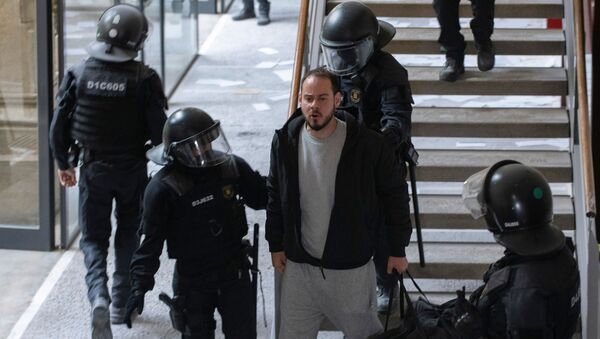 Spanish rapper Pablo Hasel reacts as he is detained by riot police inside the University of Lleida, after he was sentenced to jail time on charges including insulting the monarchy and glorifying terrorism, in Lleida, Spain February 16, 2021. - Sputnik International