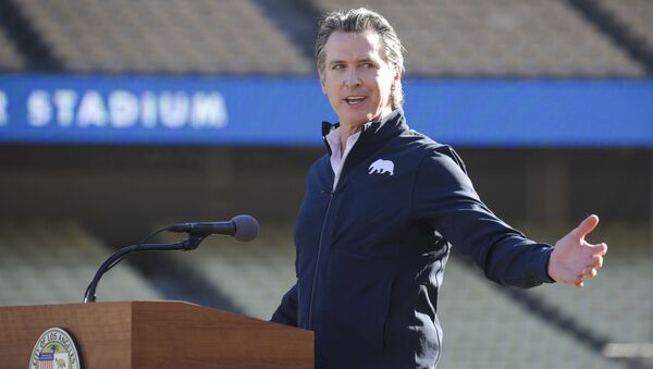 Governor Gavin Newsom addresses a press conference held at the launch of a mass COVID-19 vaccination site at Dodger Stadium on Friday, Jan. 15, 2021, in Los Angeles - Sputnik International