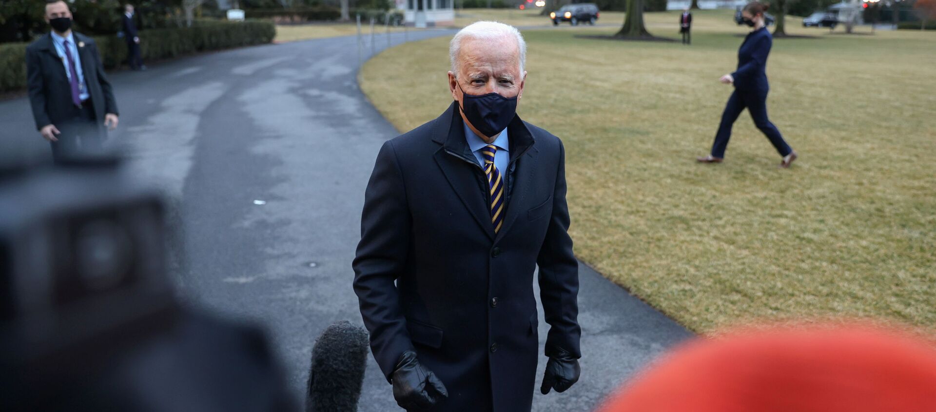 U.S. President Joe Biden speaks to members of the media as he departs for travel to Milwaukee, Wisconsin, from the South Lawn of the White House in Washington, U.S., February 16, 2021. - Sputnik International, 1920