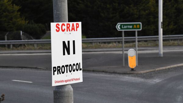 A sign is seen with a message against the Brexit border checks in relation to the Northern Ireland protocol at the harbour in Larne, Northern Ireland February 12, 2021 - Sputnik International