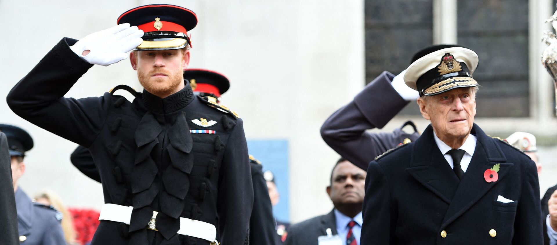 Britain's Prince Harry (L) salutes as he stands alongside his grandfather Britain's Prince Philip, Duke of Edinburgh, during their visit to the Field of Remembrance at Westminster Abbey in central London on November 10, 2016. - Sputnik International, 1920, 18.02.2021