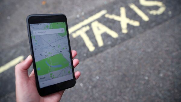 FILE PHOTO: The Uber application is seen on a mobile phone in London - Sputnik International