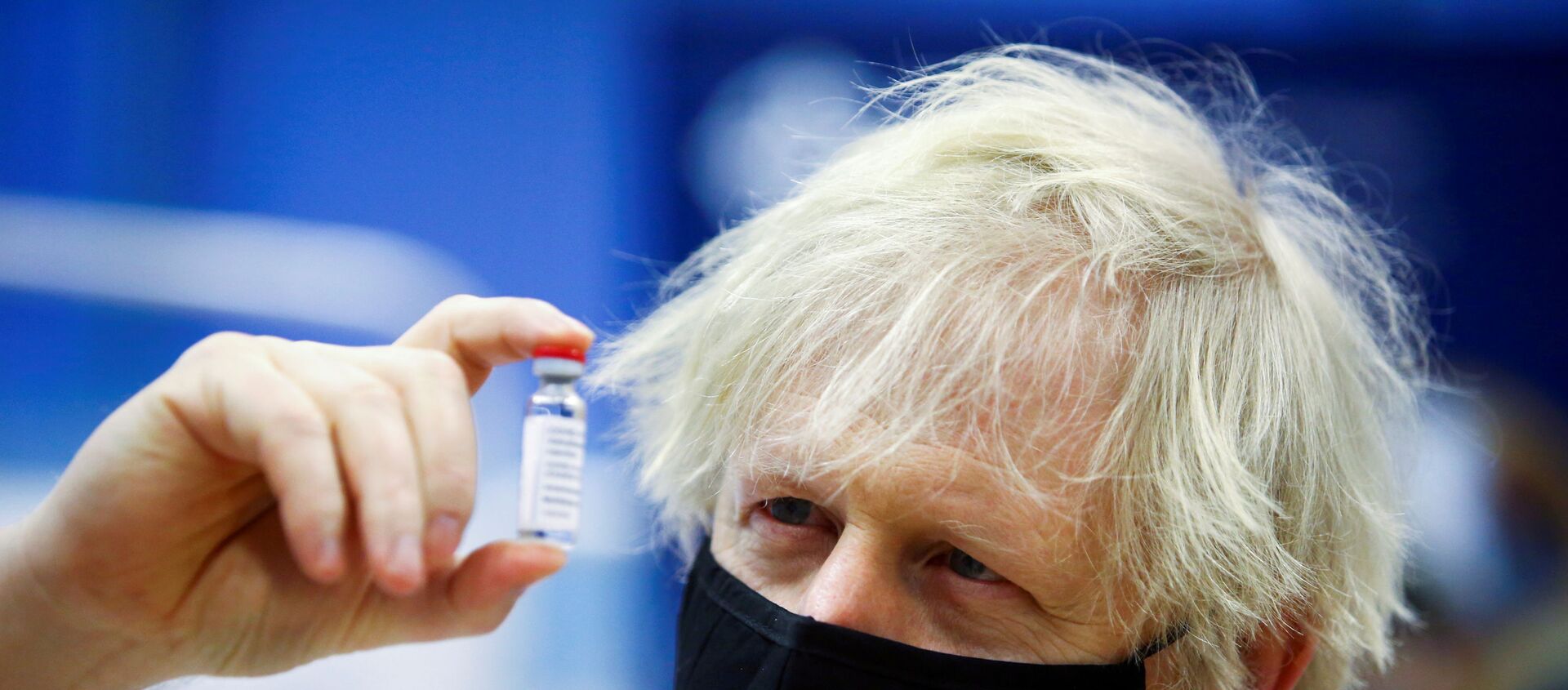 FILE PHOTO: Britain's Prime Minister Boris Johnson holds a vial of an Oxford-AstraZeneca COVID-19 vaccine, during his visit at a vaccination centre at Cwmbran Stadium in Cwmbran, south Wales, Britain February 17, 2021. Geoff Caddick/Pool via REUTERS/File Photo - Sputnik International, 1920, 12.03.2021