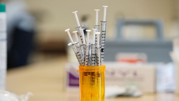 Syringes with the Pfizer-BioNTec  vaccine against coronavirus disease (COVID-19) sit on the table at the Victor Walchirk Apartments in Evanston, Illinois, US, 22 February 2021 - Sputnik International