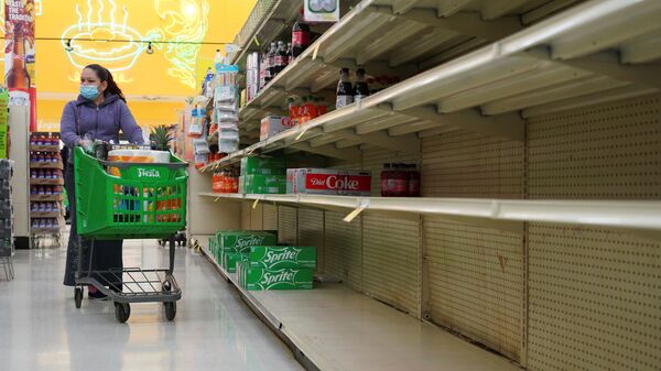 Empty shelves are seen at beverage section in Fiesta supermarket after winter weather caused food and clean water shortage in Houston, Texas, U.S. February 19, 2021 - Sputnik International