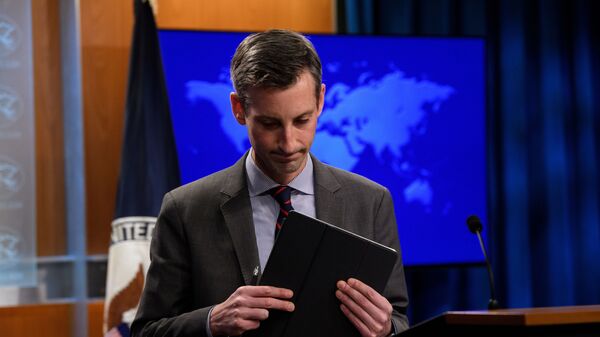 U.S. State Department spokesman Ned Price leaves after the during daily press briefing at the State Department in Washington, DC, U.S., February 22, 2021 - Sputnik International